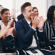 Business people, applause and conference audience, crowd and tradeshow workshop, training and motivation for presentation. Happy corporate team, clapping hands and success, goals and support meeting